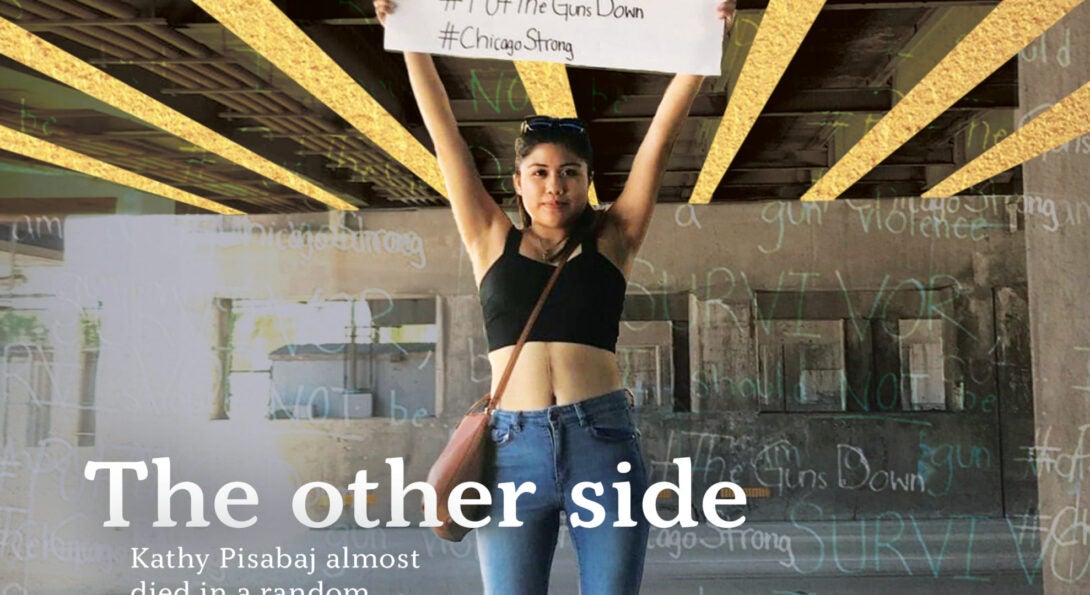 Kathy Pisabaj '22 BS NUT at a July 2018 anti-violence demonstration that shut down the northbound Dan Ryan Expressway. She wears a halter top to show scars from the injury.