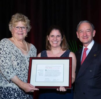 photo is of the Washington University in St. Louis Chancellor, Mark S. Wrighton, Ashley Stoffel, and the Program in Occupational Therapy Elias Michael Program Director, M. Carolyn Baum.
                  