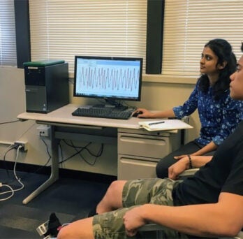 A woman and man looking at brain scans
                  