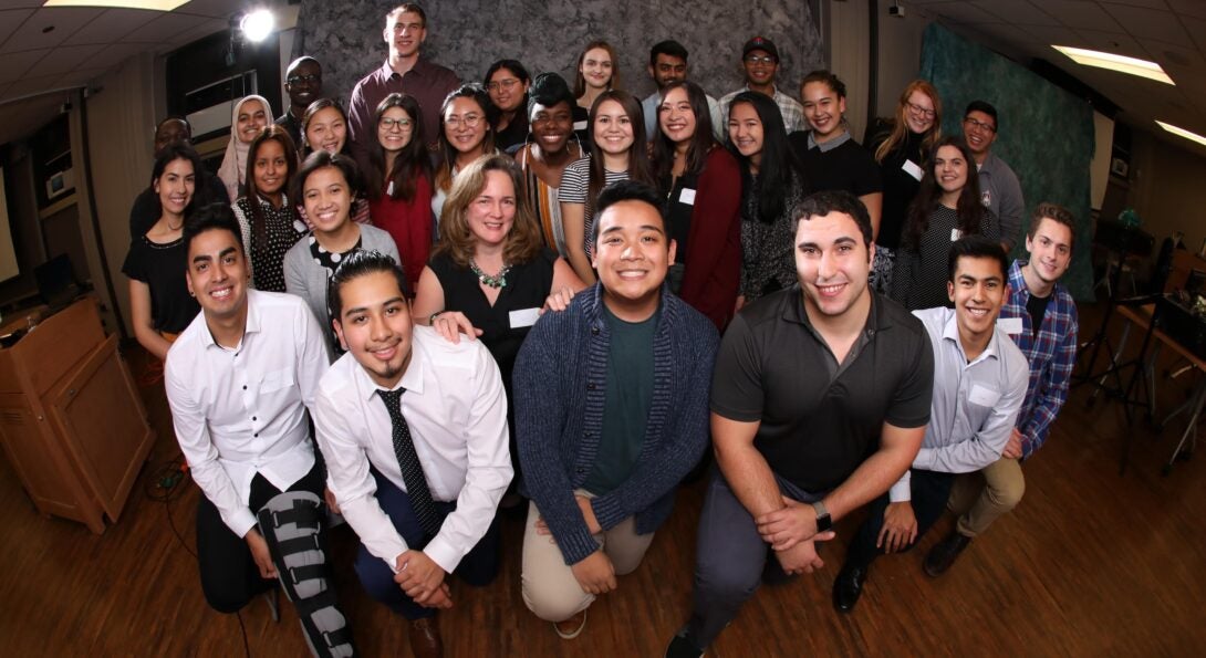 AHS students and Eileen Doran, Assistant Dean of the UIC College of Applied Health Sciences, gather for a group photo during the power hour event